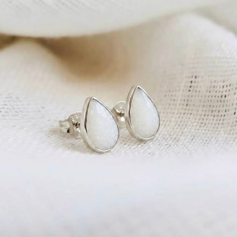 Teardrop silver stud earrings made with breastmilk.