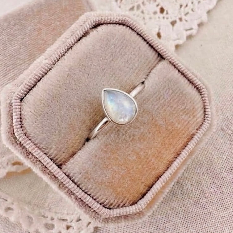 Embrace Classic pear-shaped breastmilk ring with an opalescent breastmilk stone in a delicate silver setting.