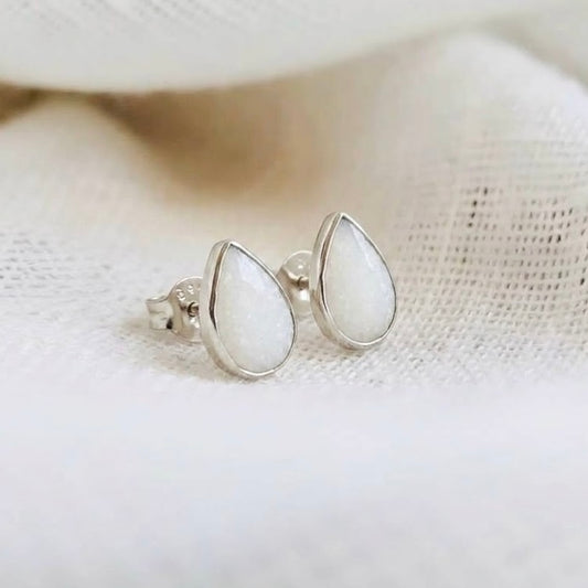 Teardrop silver stud earrings made with breastmilk.