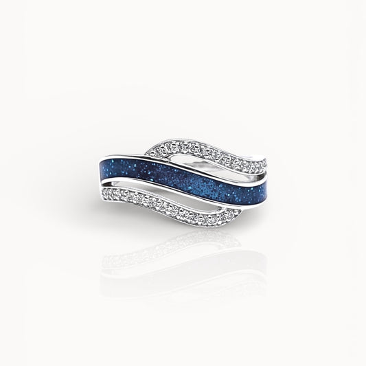 Silver ring with blue ashes channel on a white background