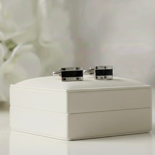 Ashes Cufflinks on a white Memory Within jewelry box with a blurred floral background