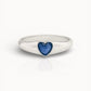 Silver ring with a blue heart ashes keepsake stone on a white background