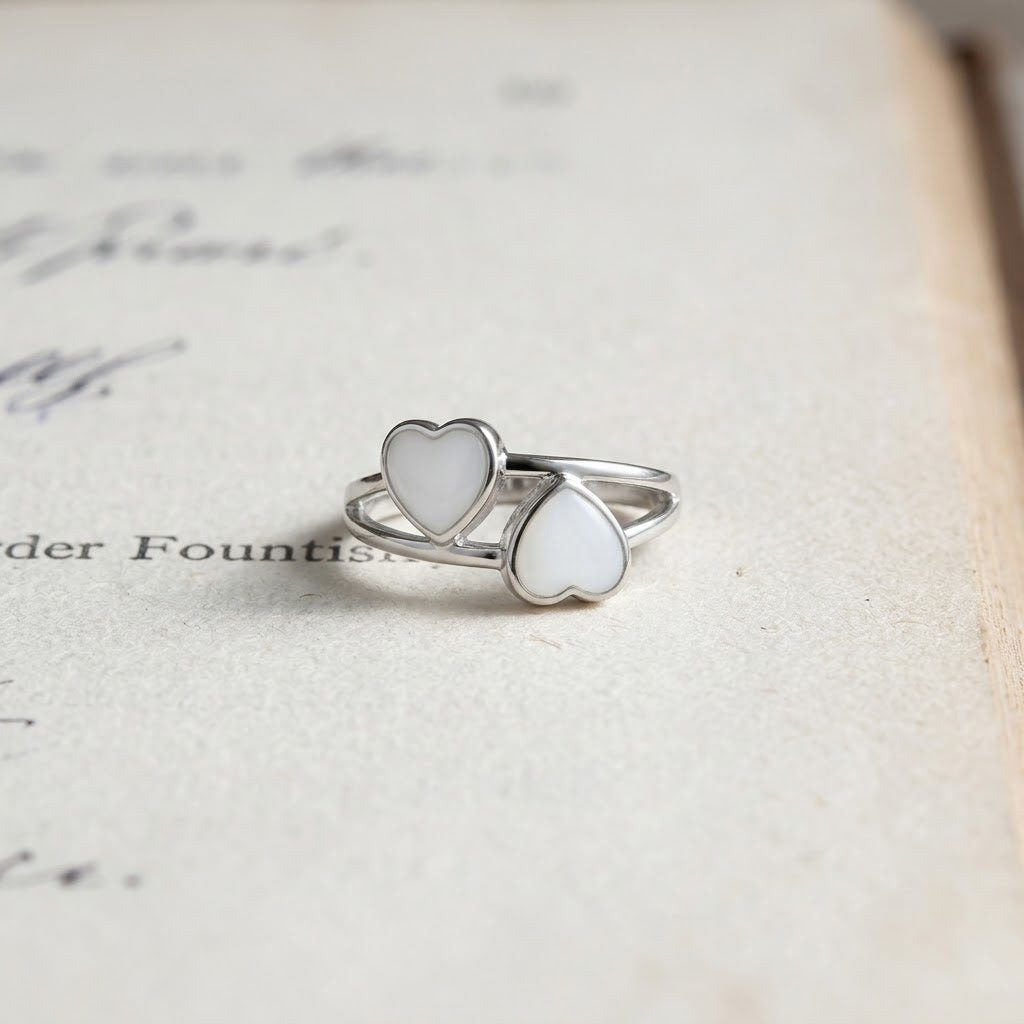 Twin Heart sterling silver breastmilk ring with two handcrafted heart-shaped breastmilk stones by MamaGems.