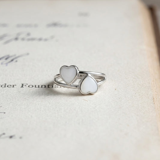 Twin Heart sterling silver breastmilk ring with two handcrafted heart-shaped breastmilk stones by MamaGems.