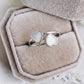 Twin Heart sterling silver breastmilk ring with two handcrafted heart-shaped breastmilk stones by MamaGems.